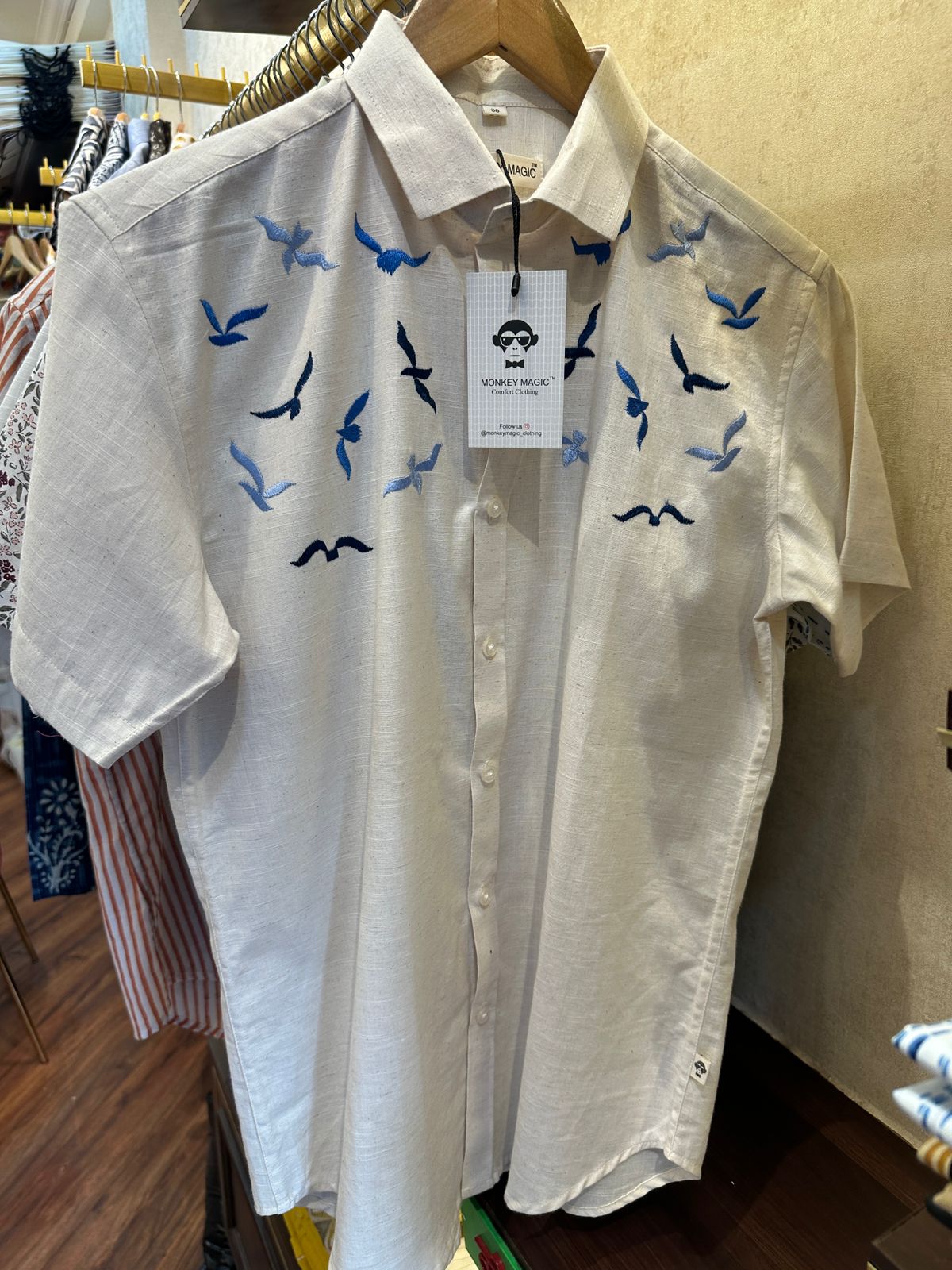 Off white shirt with EMBD