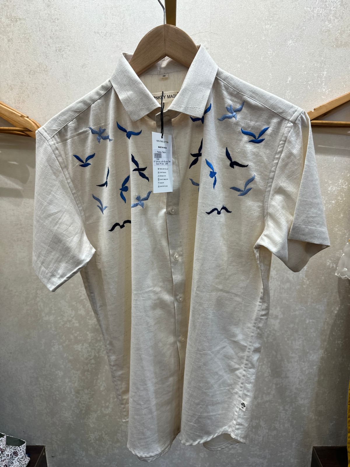 Off white shirt with EMBD